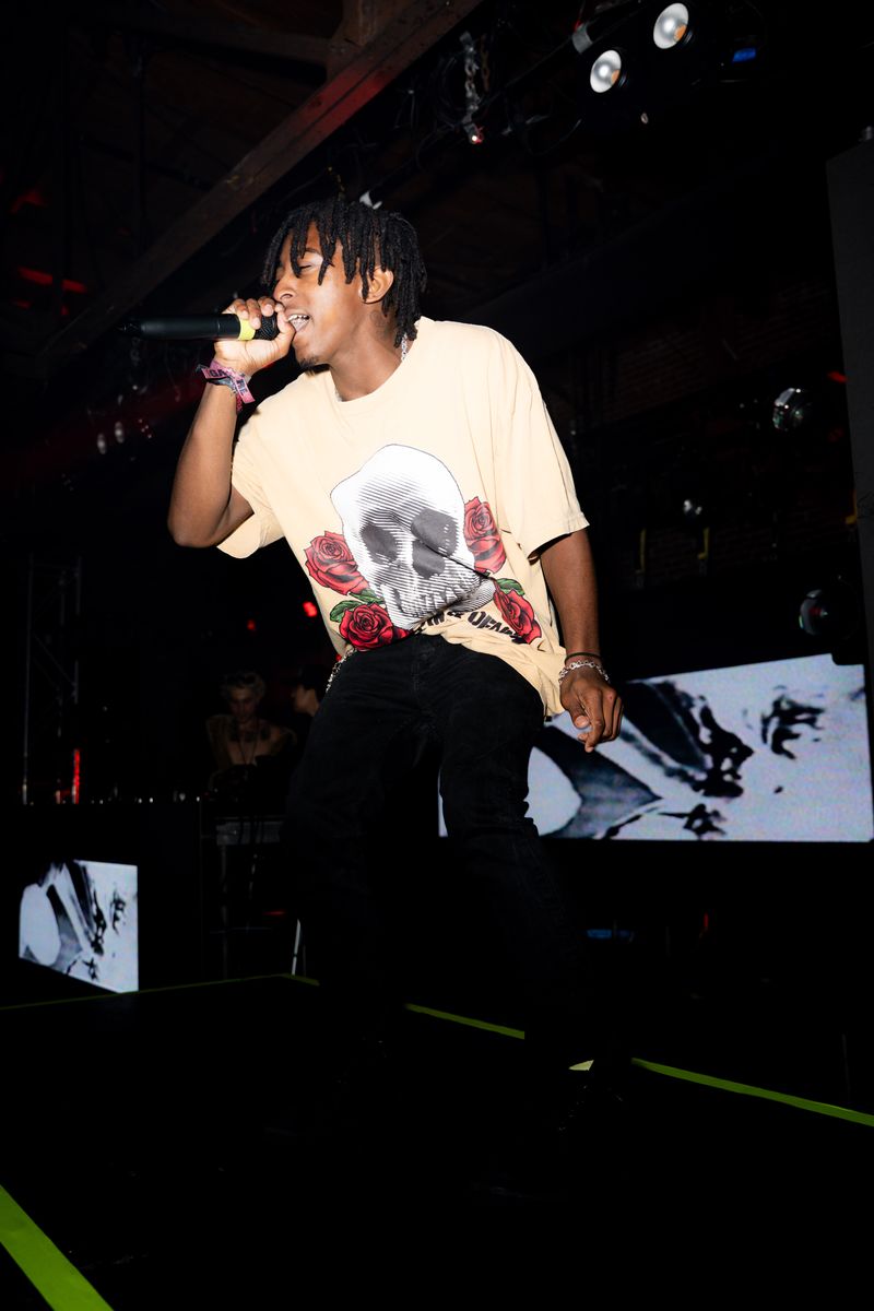 HARLEM performing in a skull and roses tee at Warehouse 1720 during the LUCKI show