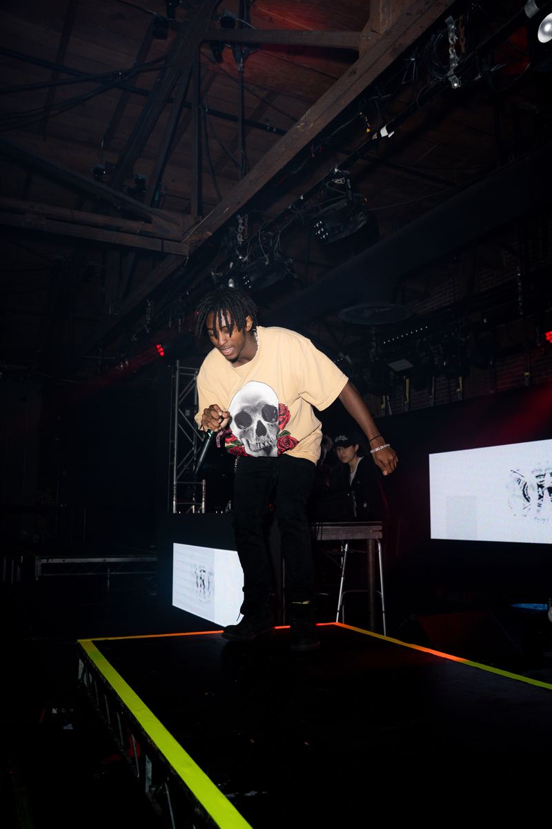 HARLEM mid set at Warehouse 1720 in a skull and roses tee