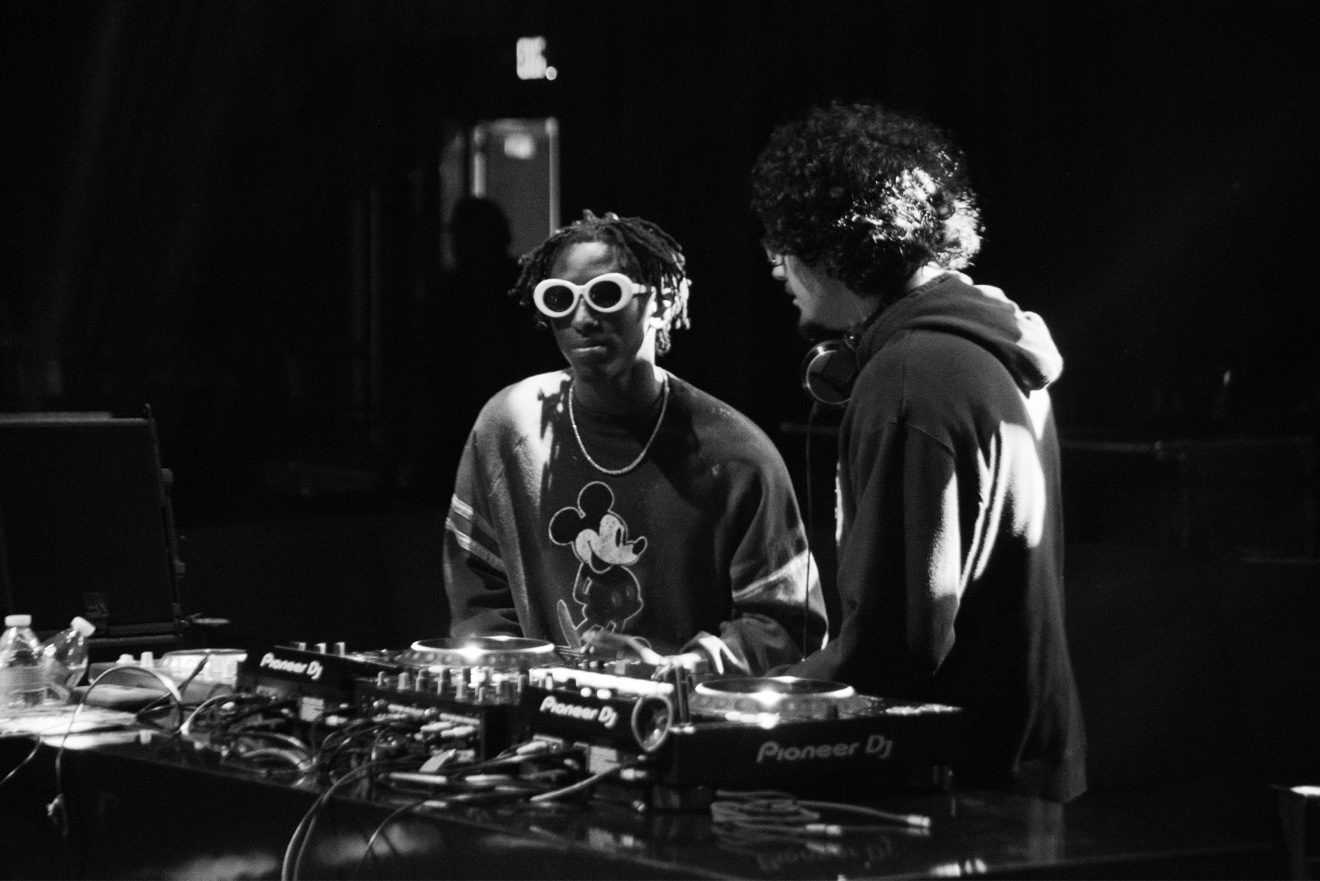 HARLEM performing beneath The Mayan stage lights