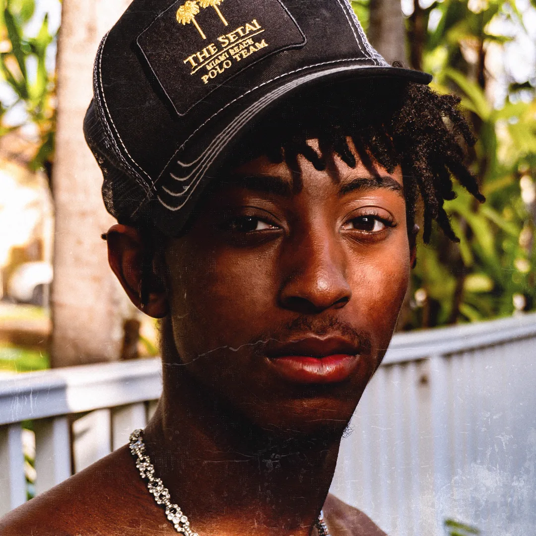 HARLEM wearing a Setai Miami Beach polo cap